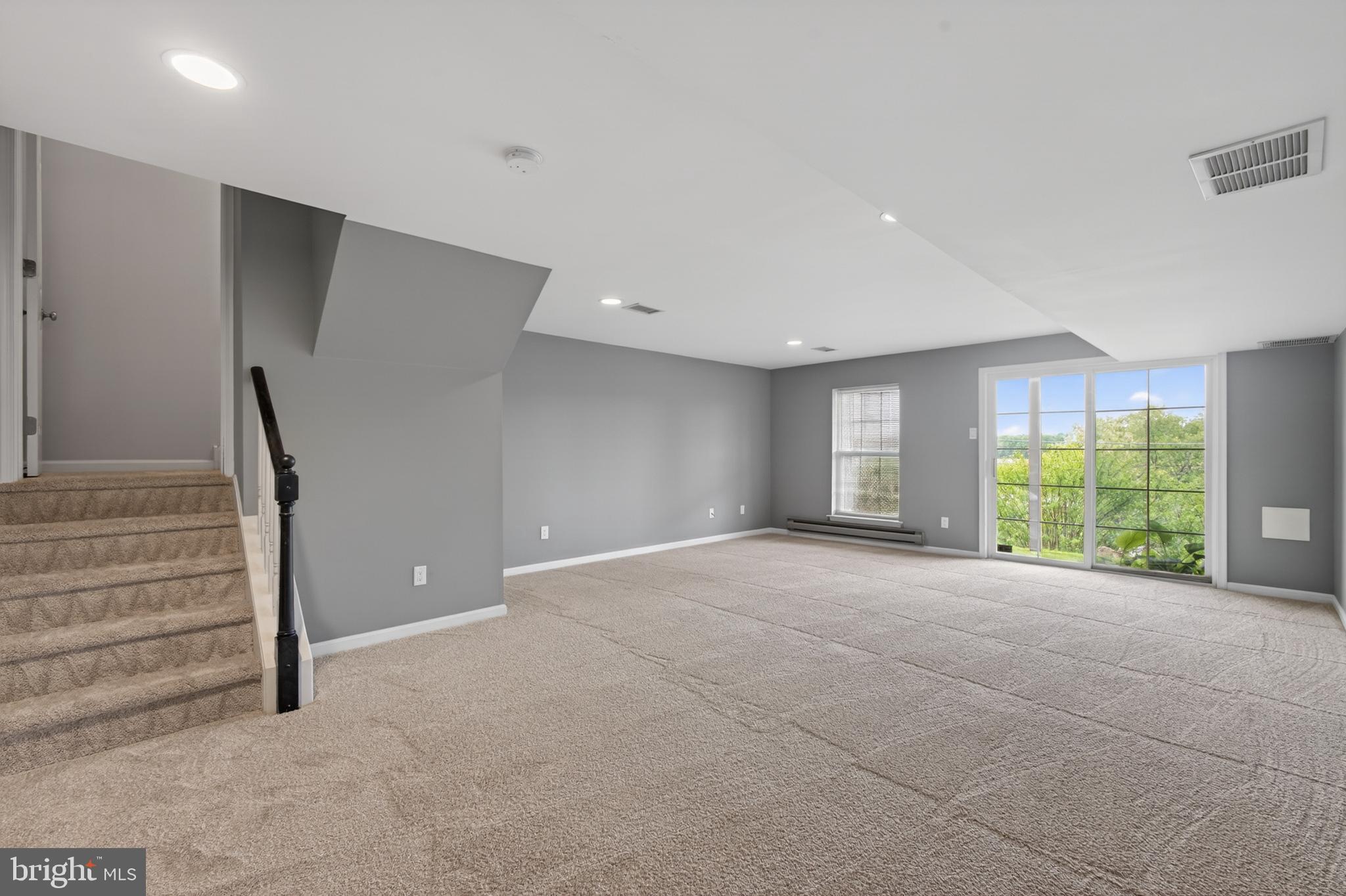 1202 Harbour Ridge Lane Downingtown, PA 19335 - Photo 25 of 37 a view of an empty room with a window and staircase