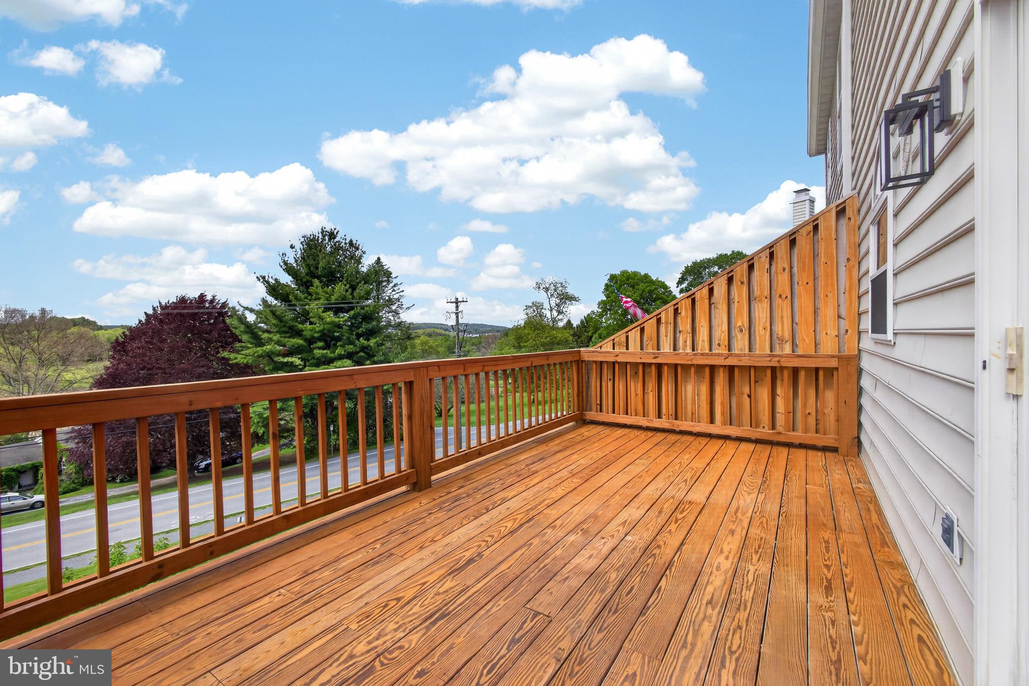 1202 Harbour Ridge Lane Downingtown, PA 19335 - Photo 27 of 37 a view of wooden balcony with a potted plant