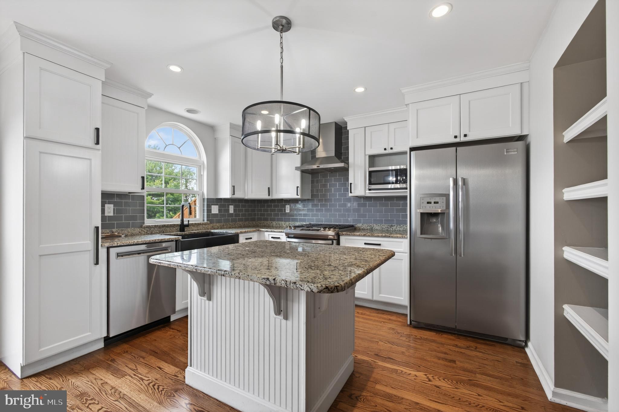 1202 Harbour Ridge Lane Downingtown, PA 19335 - Photo 6 of 37 a kitchen with stainless steel appliances granite countertop a sink a stove and a refrigerator