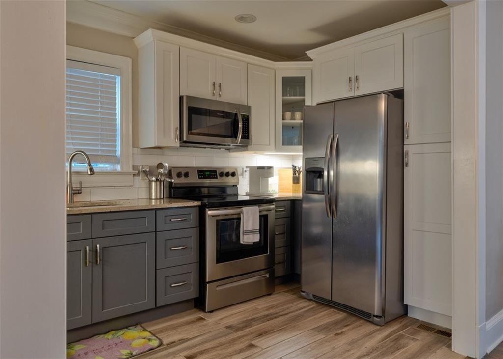 1074 Jefferson Avenue East Point, GA 30344 - Photo 2 of 13 a kitchen with a refrigerator sink and microwave