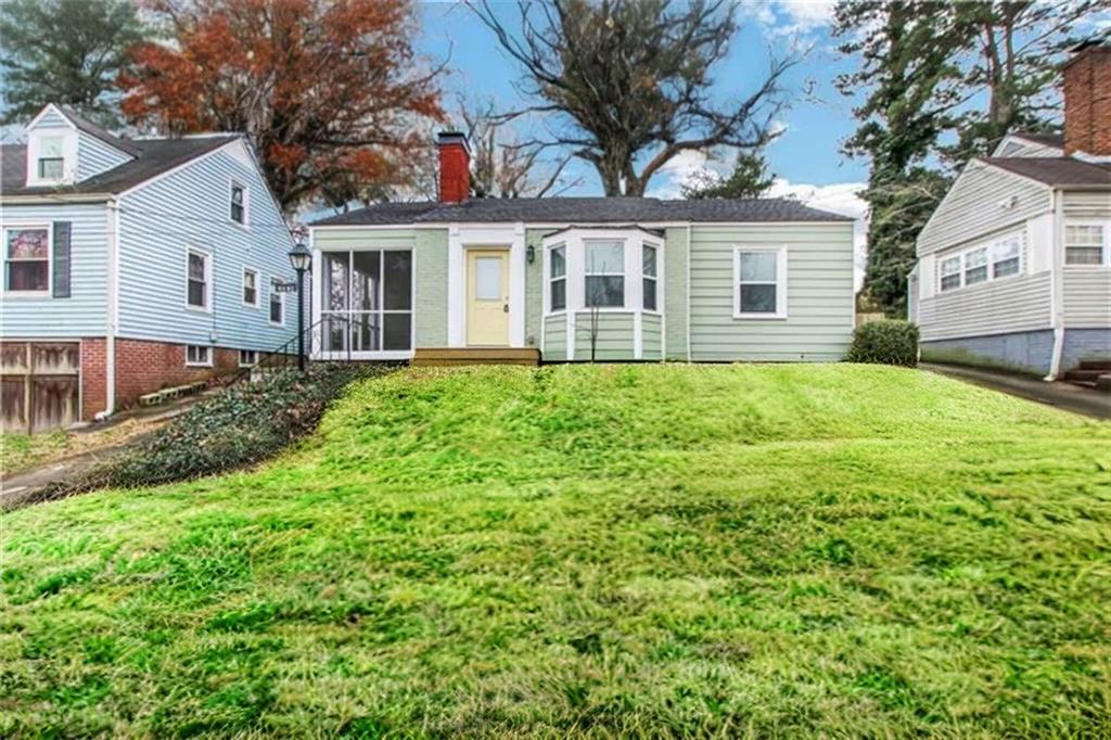 1074 Jefferson Avenue East Point, GA 30344 - Photo 10 of 13 a white house that has a tree in front of it