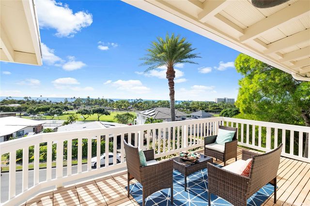 a view of a chair and tables the patio