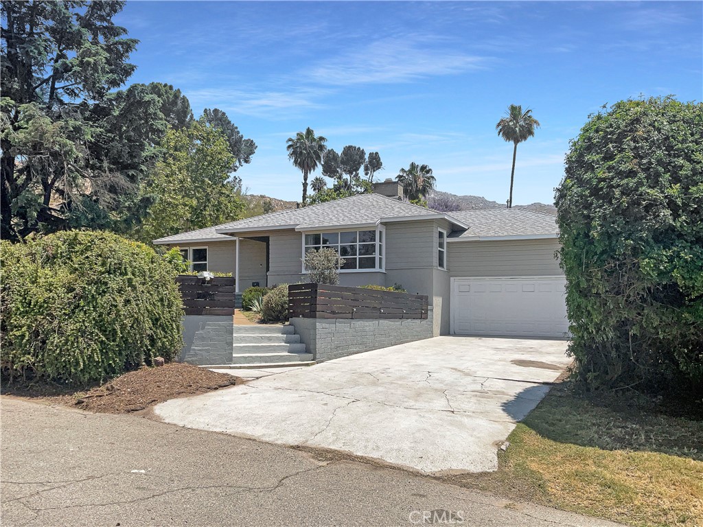3008 Floral Avenue Riverside, CA 92507 - Photo 1 of 1 a front view of a house with a yard and garage
