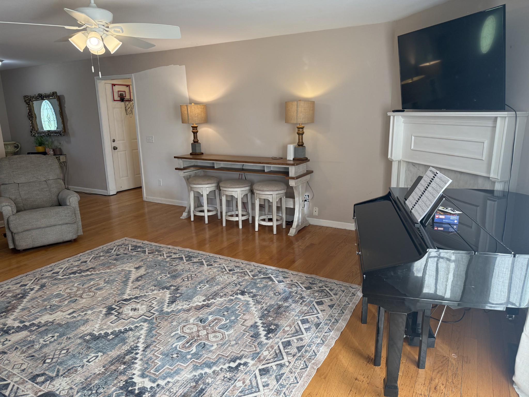 1702 Abiff Road Burns, TN 37029 - Photo 18 of 47 a living room with furniture a flat screen tv and kitchen view