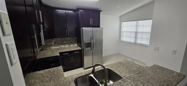 a bathroom with a shower and a door