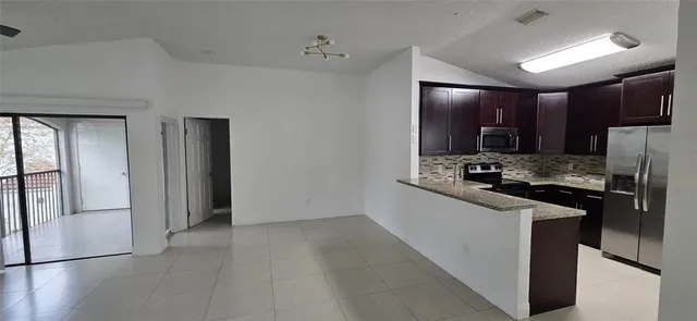 a view of a room that has a window in it