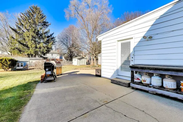 a view of a car park in front of a house