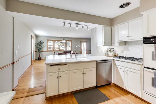 a spacious bathroom with a granite countertop sink a mirror and a