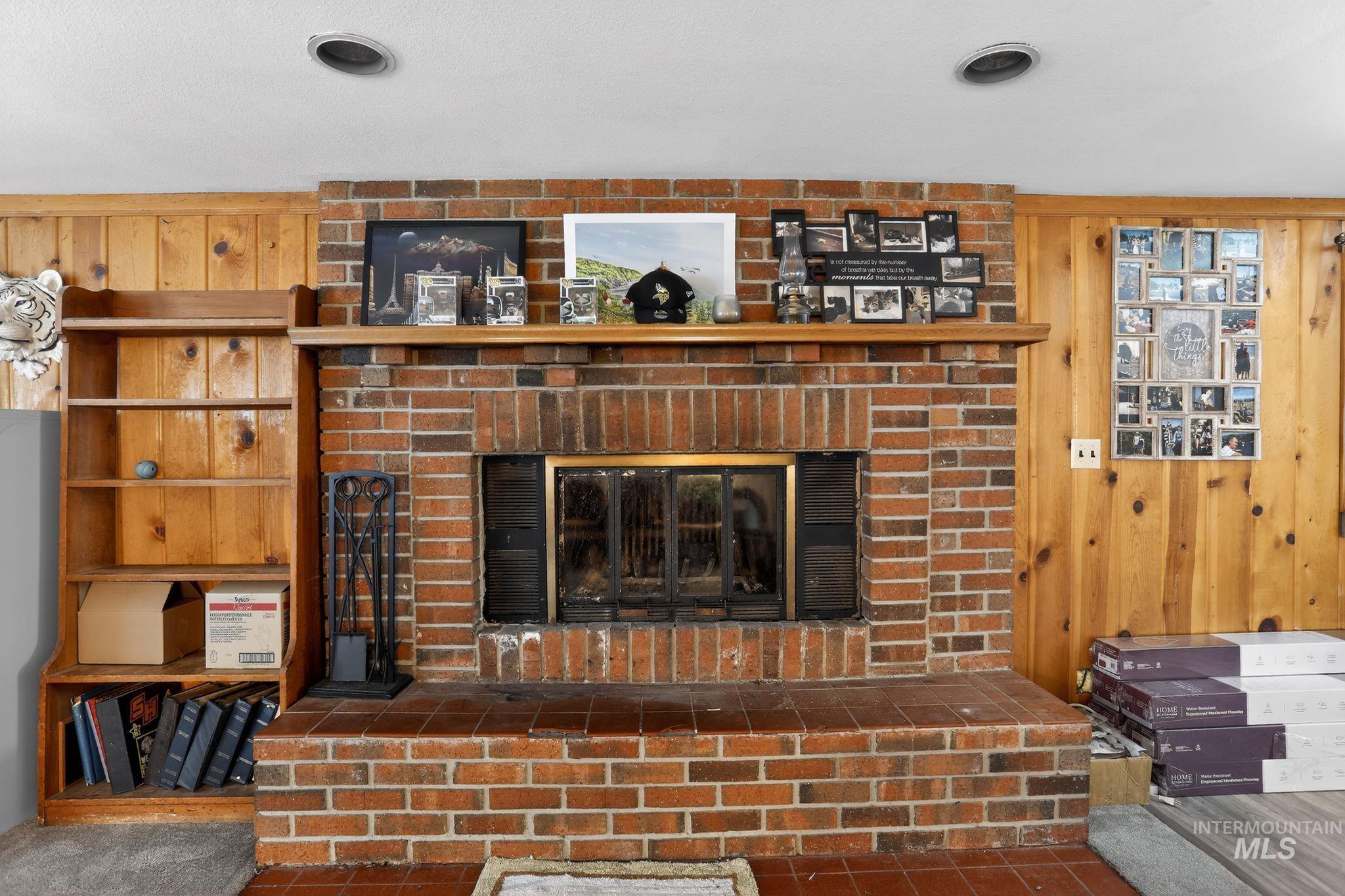 654 Bings Road Cascade, ID 83611 - Photo 15 of 40 Detailed view of wooden walls and a fireplace
