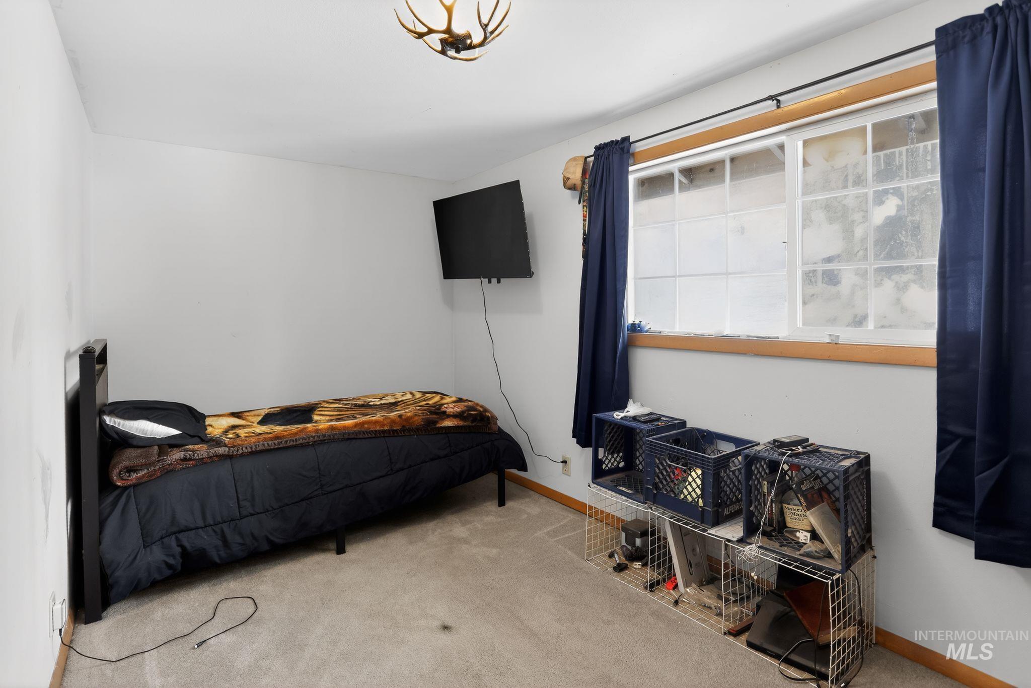 654 Bings Road Cascade, ID 83611 - Photo 27 of 40 Carpeted bedroom featuring baseboards
