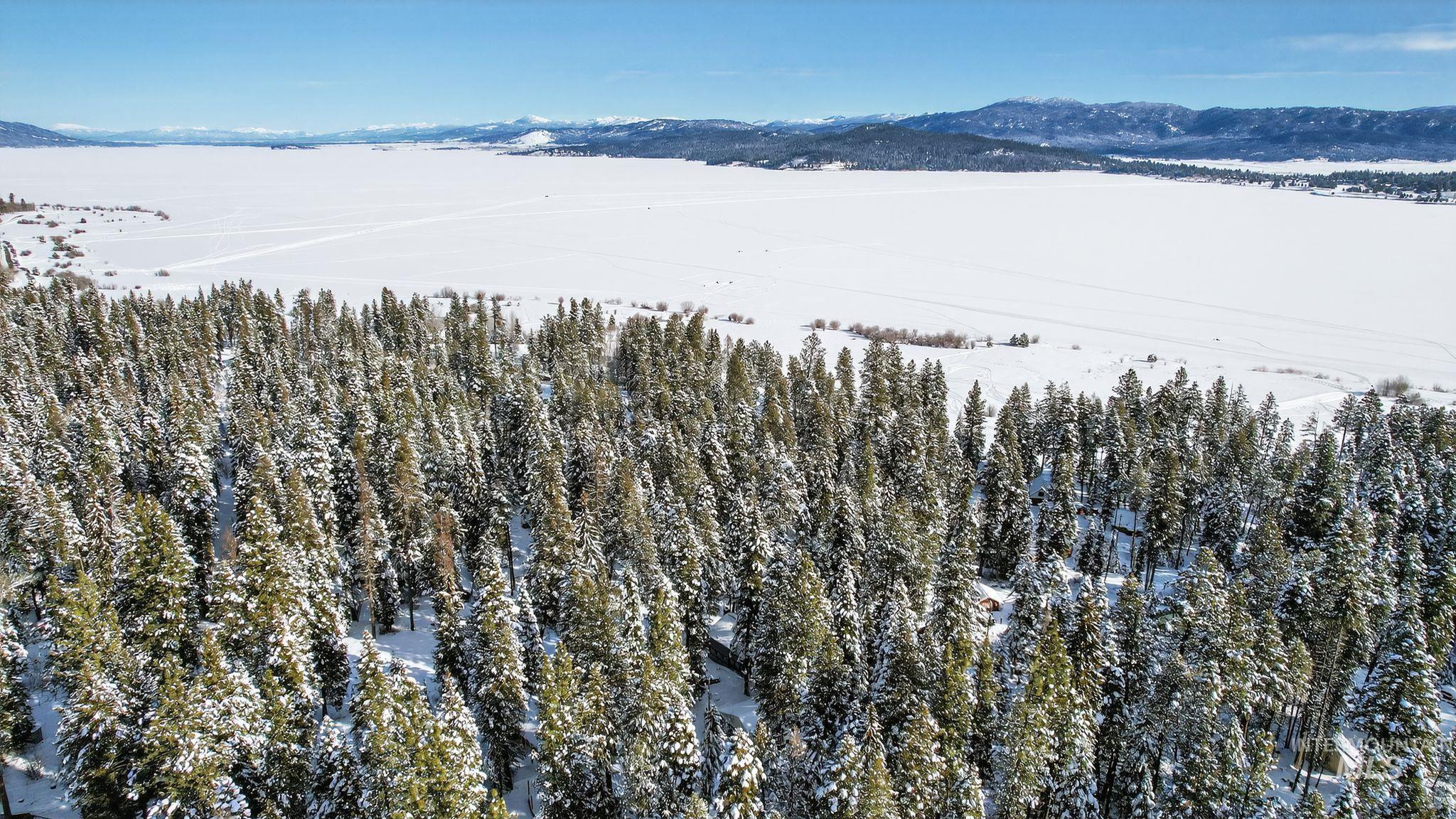 654 Bings Road Cascade, ID 83611 - Photo 30 of 40 Snowy aerial view with a mountain view