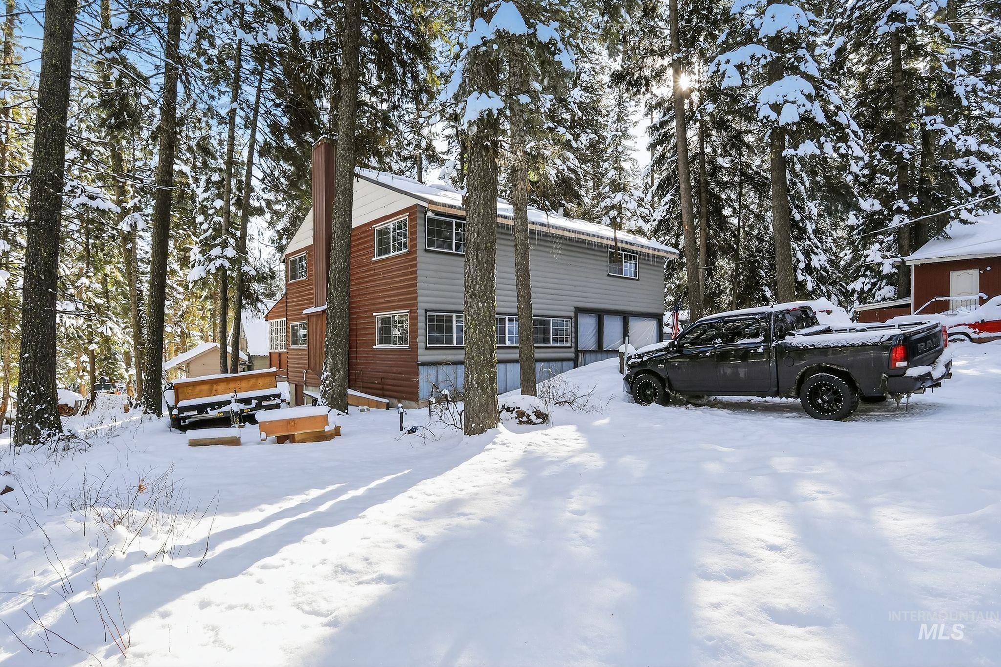 654 Bings Road Cascade, ID 83611 - Photo 34 of 40 View of snow covered exterior featuring a chimney