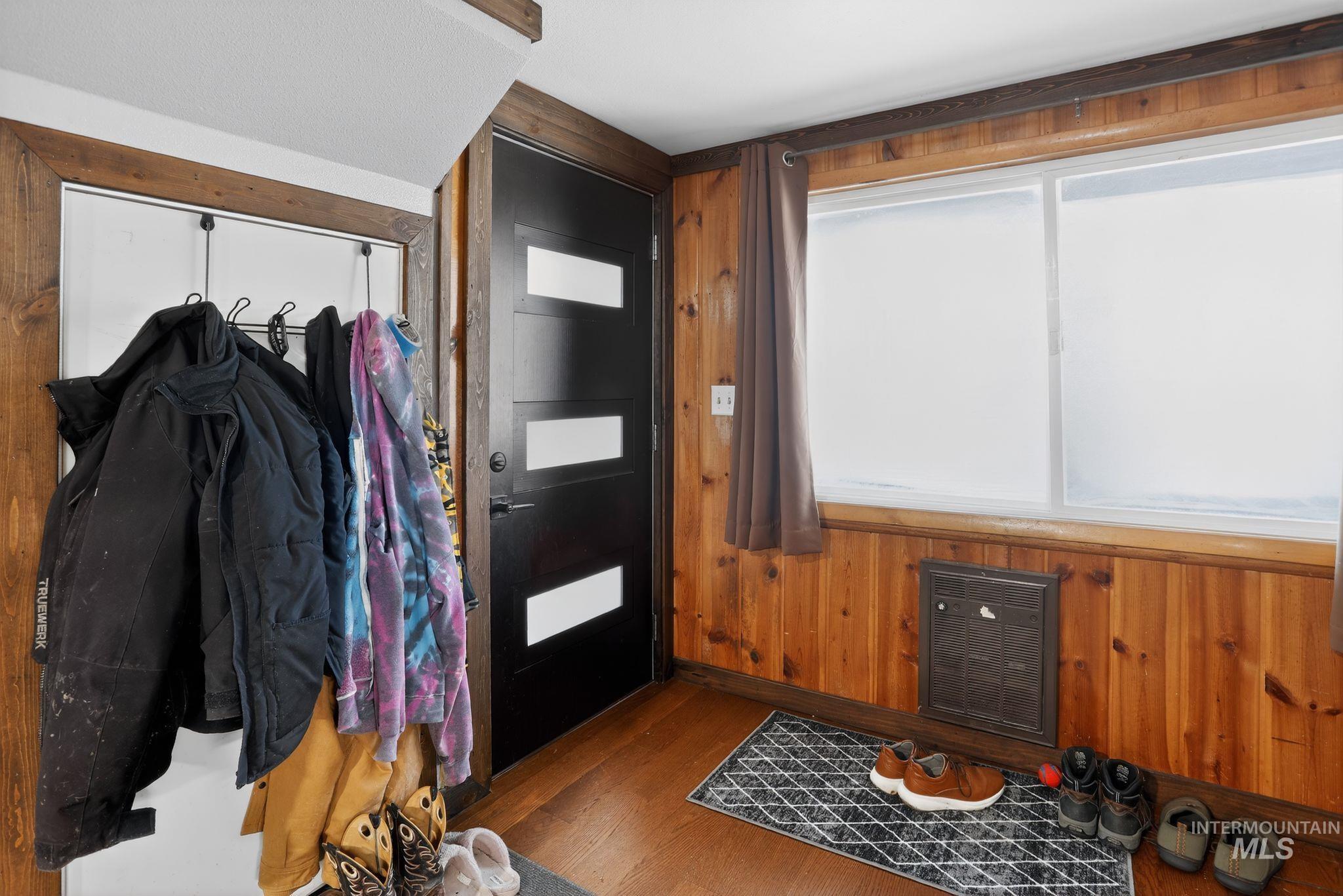 654 Bings Road Cascade, ID 83611 - Photo 7 of 40 Foyer with hardwood / wood-style floors and wooden walls