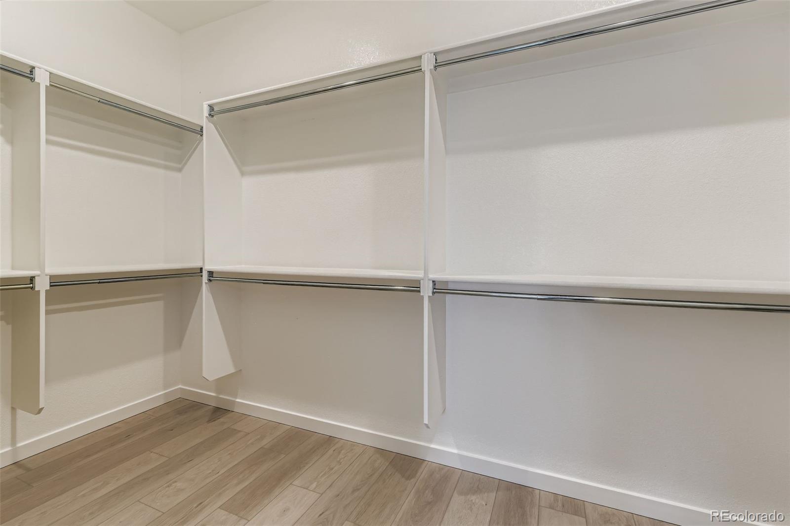 8895 South Riviera Way Aurora, CO 80016 - Photo 16 of 26 a view of an empty walk in closet