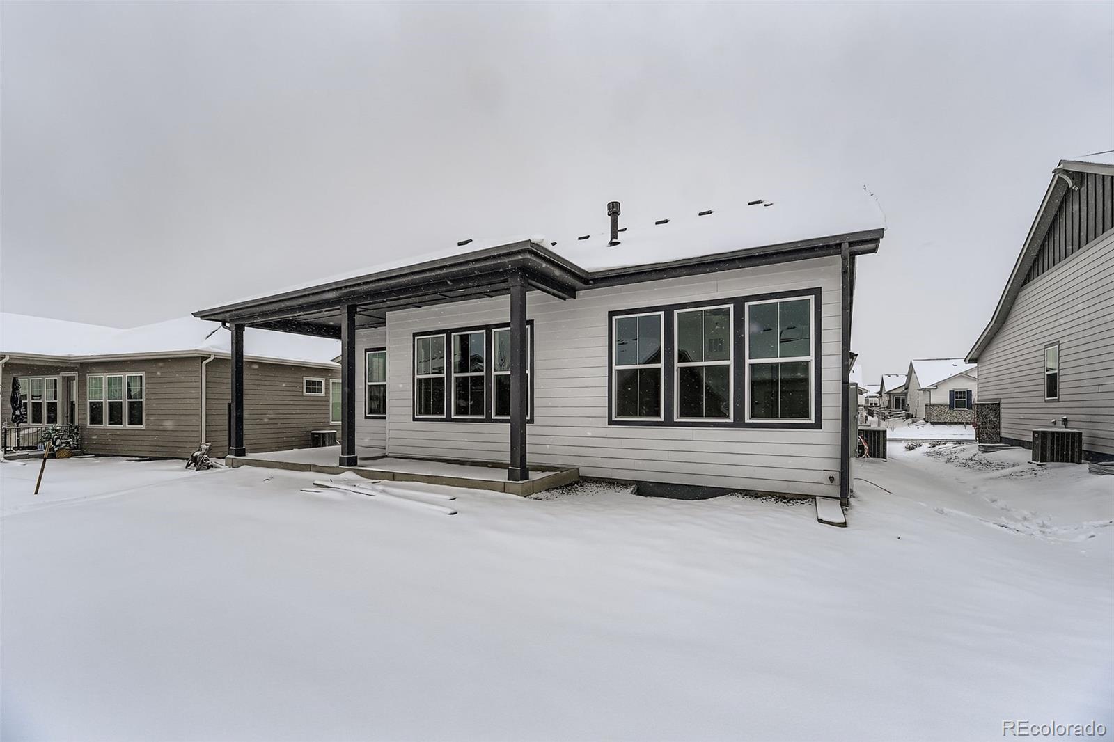 8895 South Riviera Way Aurora, CO 80016 - Photo 26 of 26 a view of house with backyard and parking