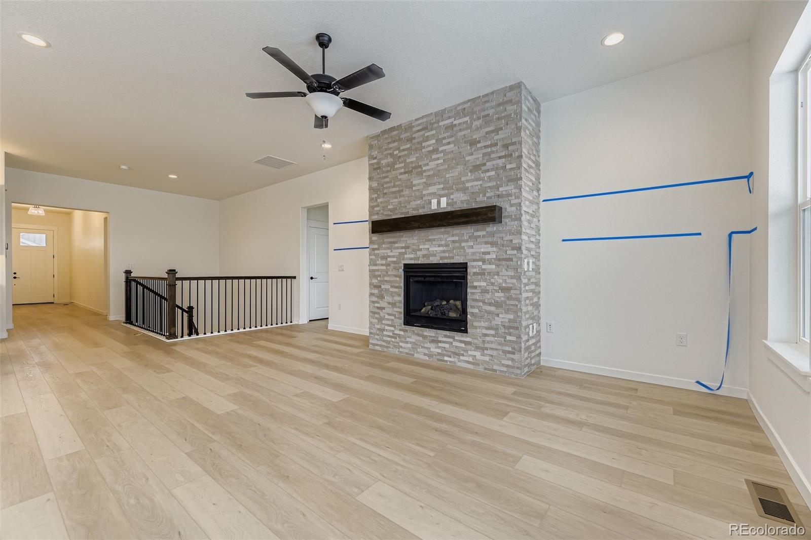 8895 South Riviera Way Aurora, CO 80016 - Photo 8 of 26 a view of an empty room with a fireplace