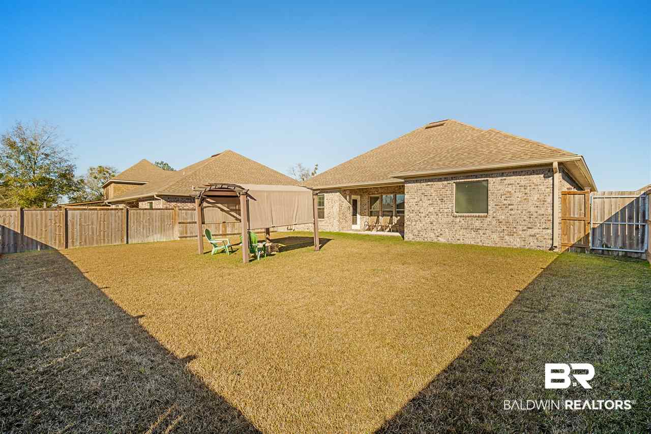 8687 Rosedown Lane Daphne, AL 36526 - Photo 22 of 27 Fenced Backyard