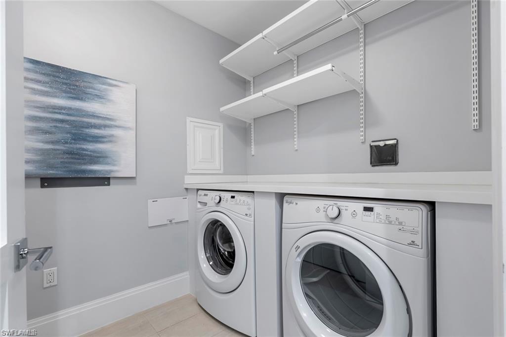 1030 3rd Avenue South, Unit 315 Naples, FL 34102 - Photo 17 of 29 a utility room with dryer and washer