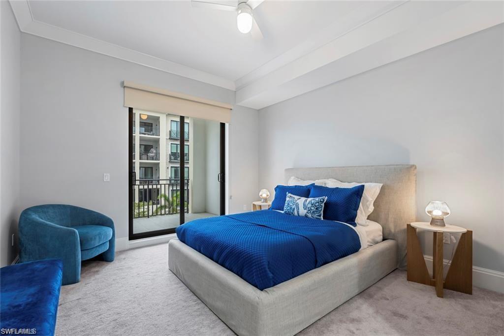 1030 3rd Avenue South, Unit 315 Naples, FL 34102 - Photo 18 of 29 a bedroom with a bed and a chair