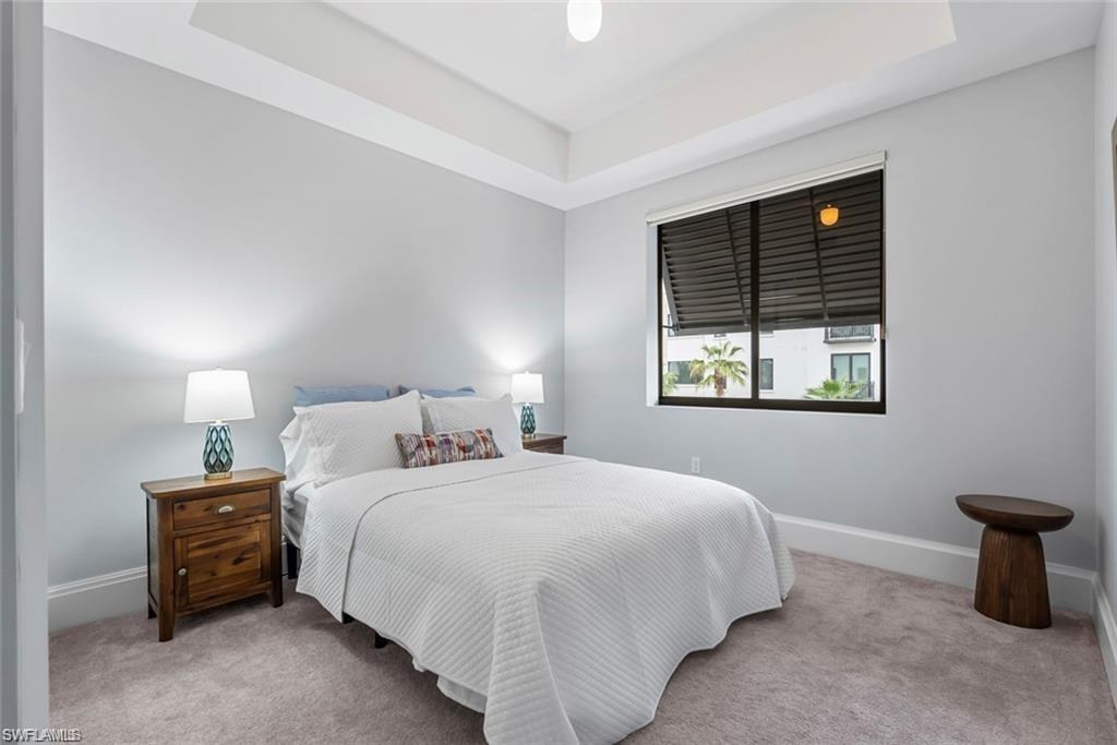 1030 3rd Avenue South, Unit 315 Naples, FL 34102 - Photo 22 of 29 a bedroom with a bed and a window