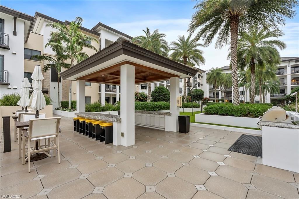 1030 3rd Avenue South, Unit 315 Naples, FL 34102 - Photo 27 of 29 a view of a house with backyard and porch