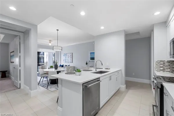 a kitchen with a sink and a microwave