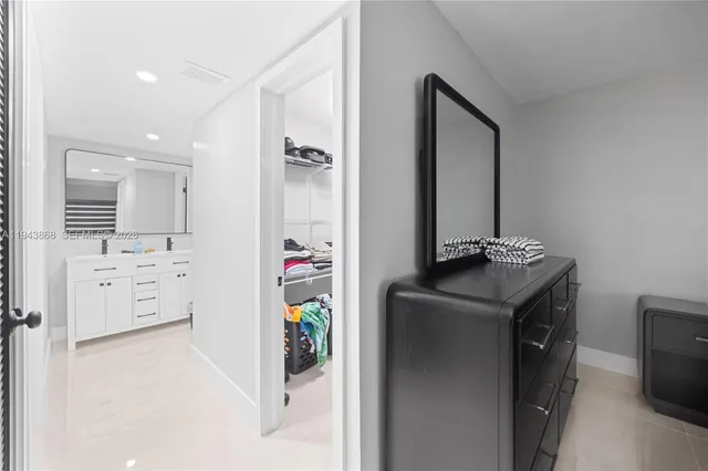 a utility room with cabinets washer and dryer