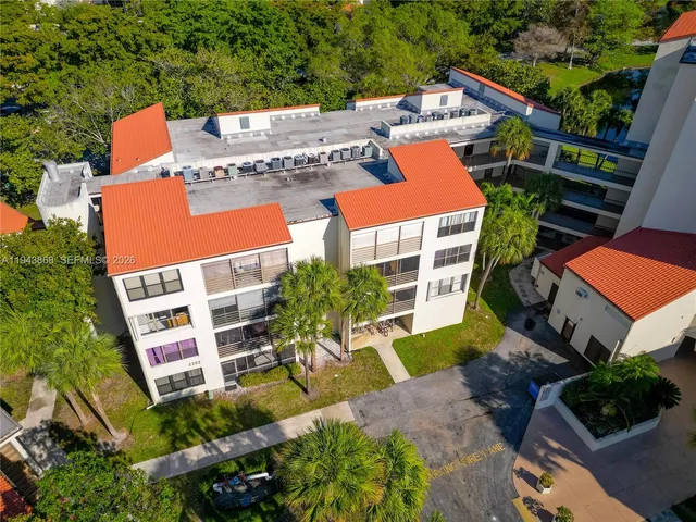 an aerial view of residential house with outdoor space and swimming pool