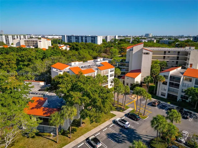 an aerial view of a house with yard swimming pool and outdoor seating