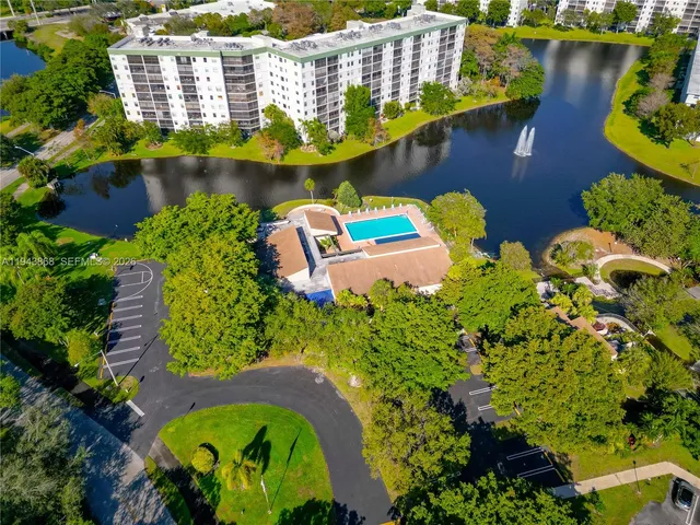 an aerial view of a house with a swimming pool