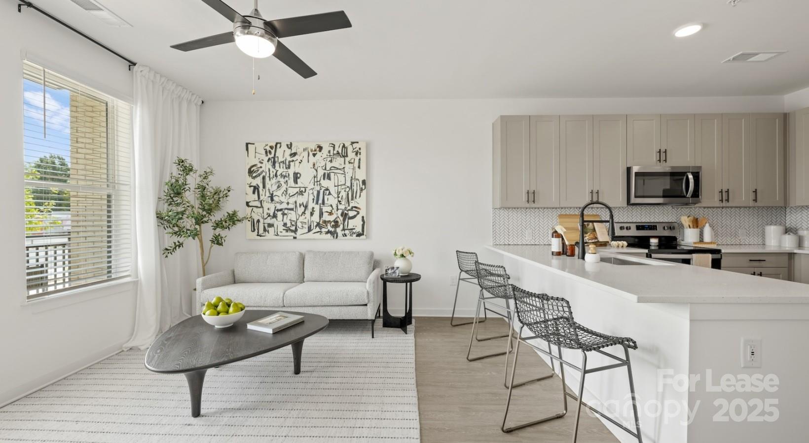 2314 Berryhill Road, Unit 1M Charlotte, NC 28208 - Photo 22 of 31 a living room with furniture and a window