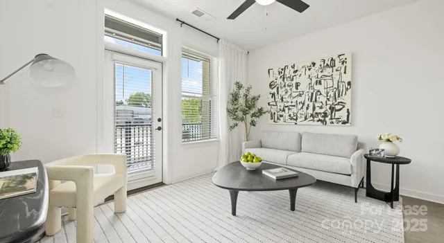 a living room with furniture and wooden floor