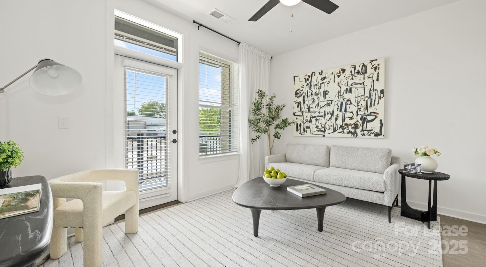 2314 Berryhill Road, Unit 1M Charlotte, NC 28208 - Photo 23 of 31 a living room with furniture and wooden floor