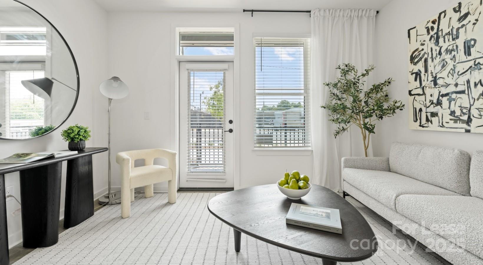 2314 Berryhill Road, Unit 1M Charlotte, NC 28208 - Photo 24 of 31 a living room with furniture and wooden floor