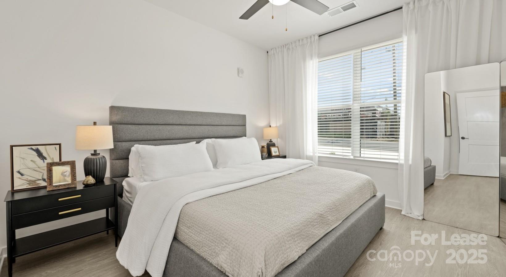 2314 Berryhill Road, Unit 1M Charlotte, NC 28208 - Photo 25 of 31 a bedroom with a bed and a window