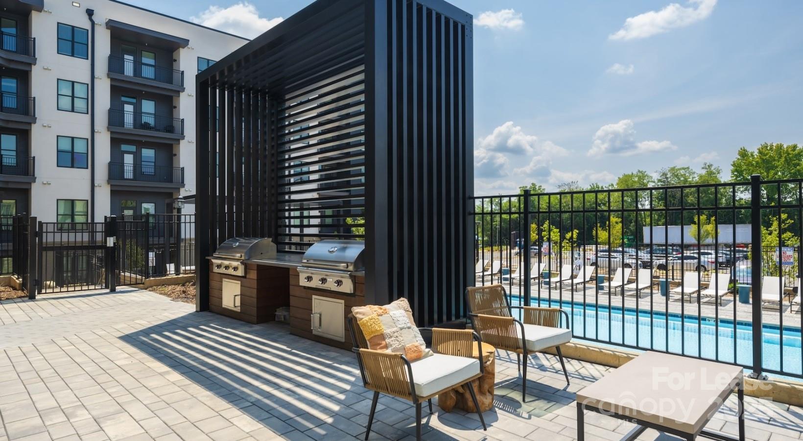2314 Berryhill Road, Unit 1M Charlotte, NC 28208 - Photo 31 of 31 a view of a balcony with chairs