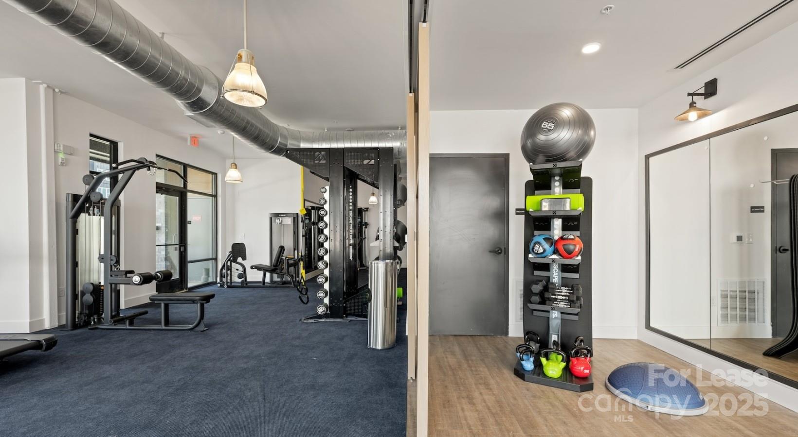 2314 Berryhill Road, Unit 1M Charlotte, NC 28208 - Photo 5 of 31 a view of game room with gym equipment