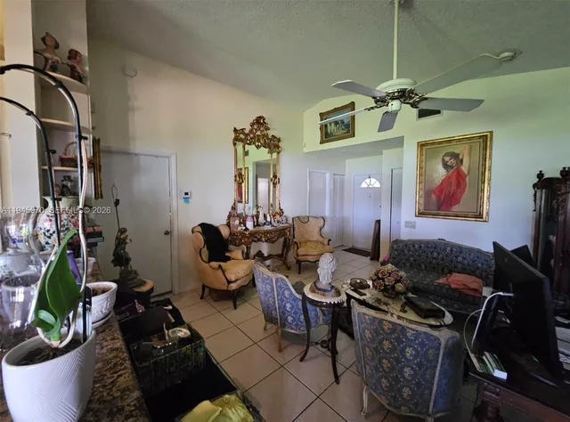 a living room with lots of furniture and gym equipment