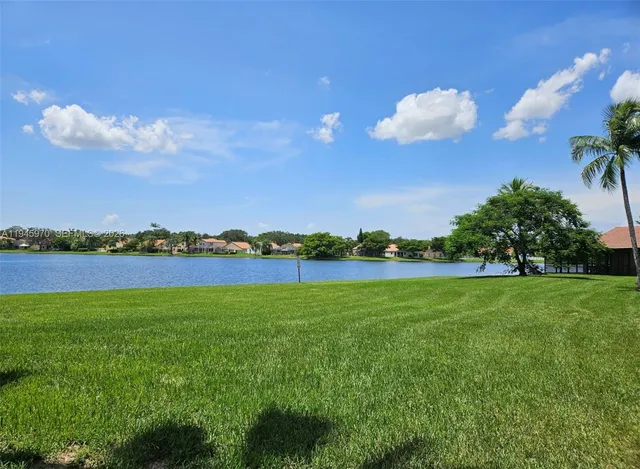 a view of a golf course with a lake