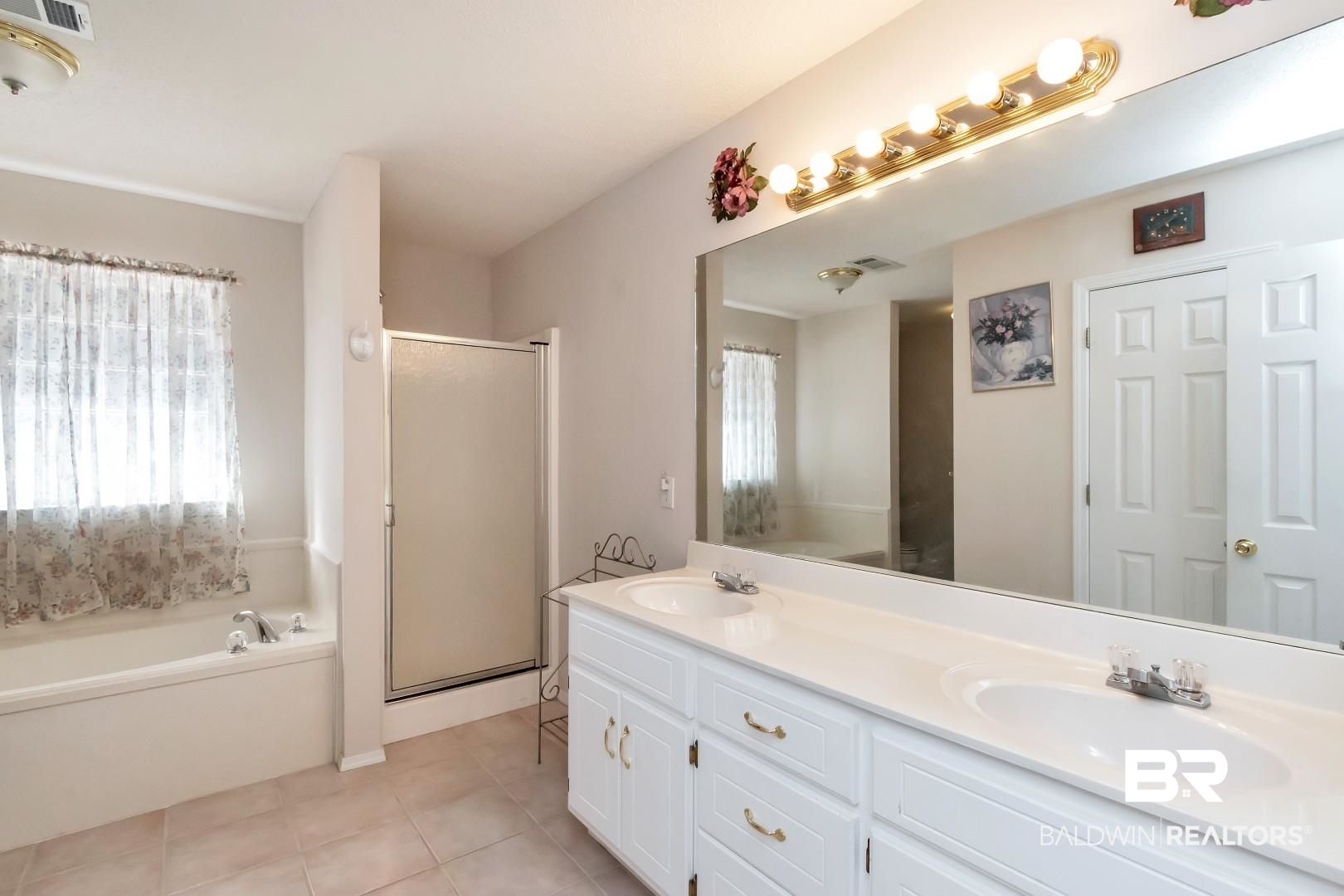 8221 Woodbend Drive Semmes, AL 36575 - Photo 20 of 35 Bathroom featuring tile patterned floors, vanity, and separate shower and tub