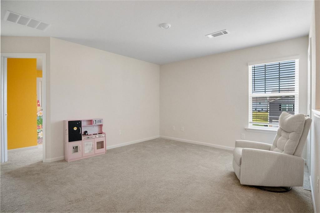 217 Limestone Circle Conyers, GA 30013 - Photo 18 of 21 a living room with furniture and a window
