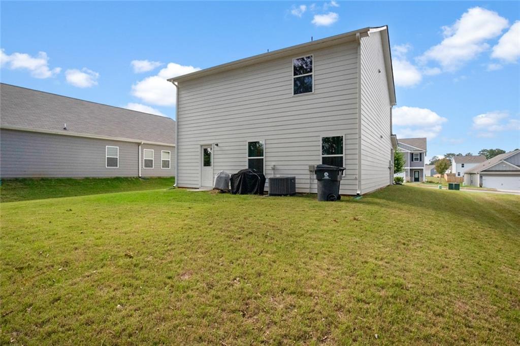 217 Limestone Circle Conyers, GA 30013 - Photo 5 of 21 a view of a house with backyard and garden
