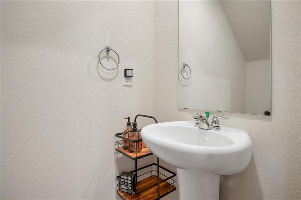 217 Limestone Circle Conyers, GA 30013 - Photo 7 of 21 a bathroom with a sink and a mirror