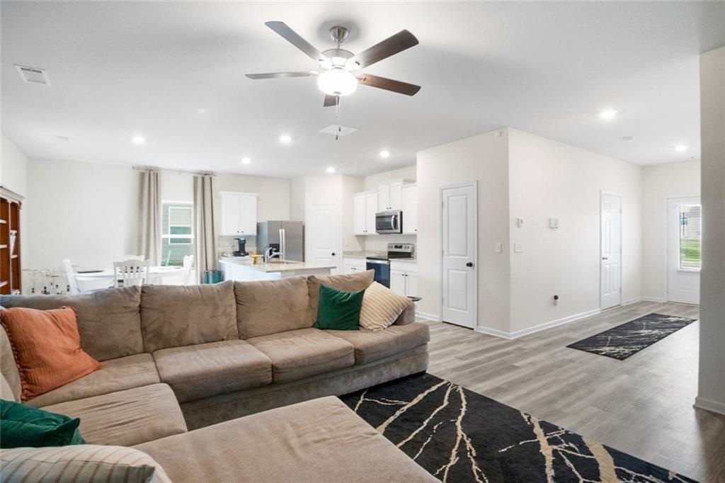 217 Limestone Circle Conyers, GA 30013 - Photo 9 of 21 a living room with furniture and kitchen view