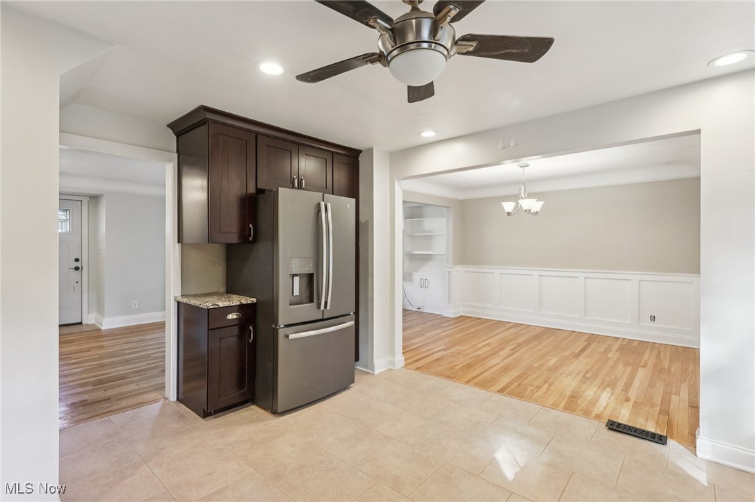 1151 Croyden Road Lyndhurst, OH 44124 - Photo 11 of 37 Kitchen with dark brown cabinetry, stainless steel fridge with ice dispenser, light tile patterned flooring, a ceiling fan, and recessed lighting