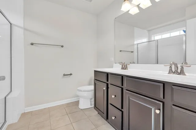 a bathroom with a sink toilet and vanity