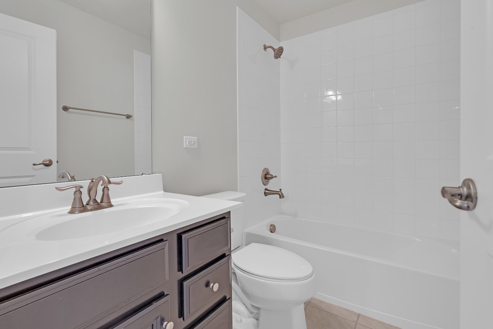 773 Rockwell Lane Des Plaines, IL 60016 - Photo 14 of 22 a bathroom with a sink toilet vanity and tub