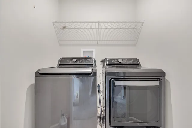 a view of storage and utility room with washer and dryer