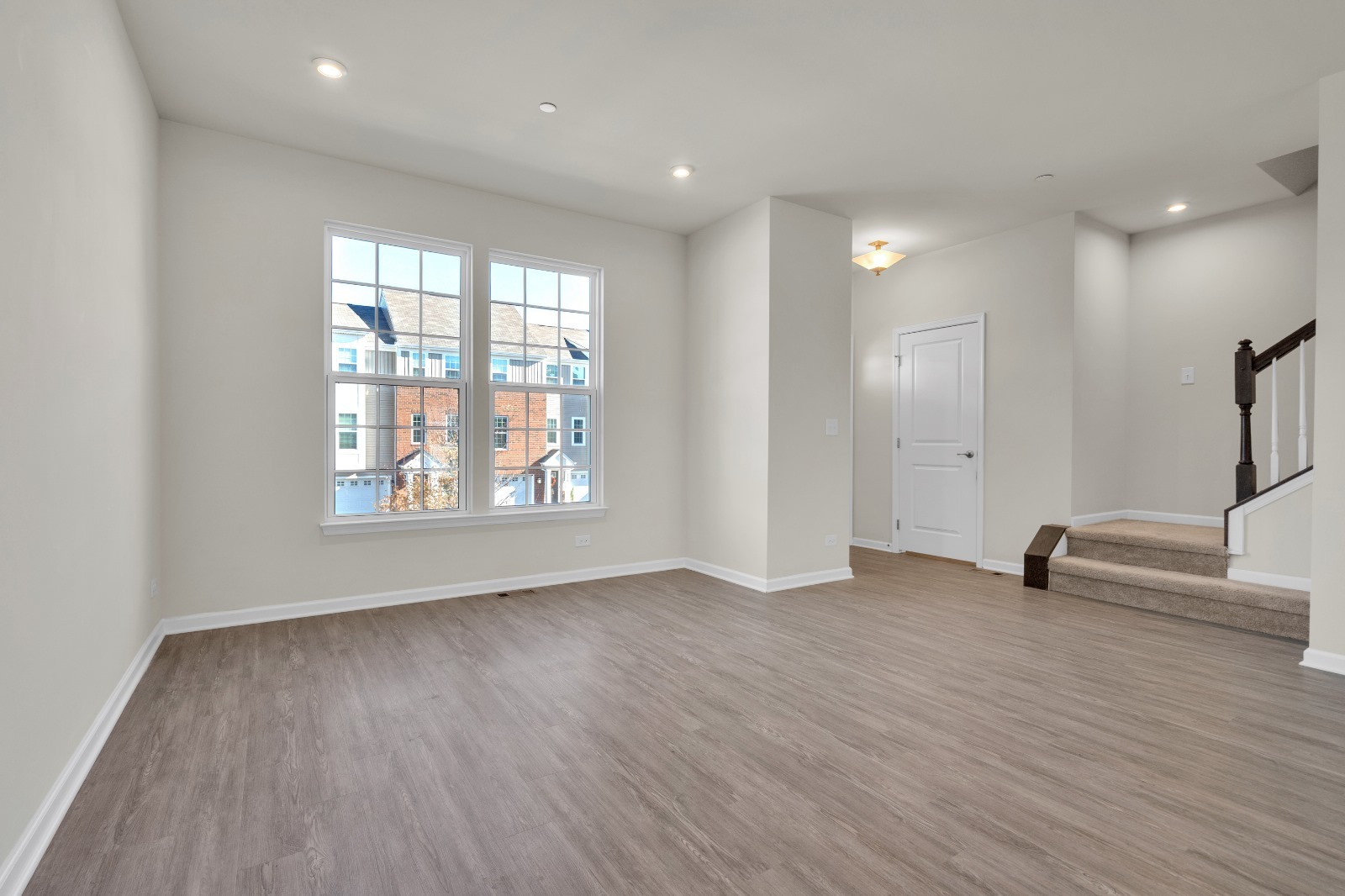 773 Rockwell Lane Des Plaines, IL 60016 - Photo 3 of 22 an empty room with wooden floor and windows