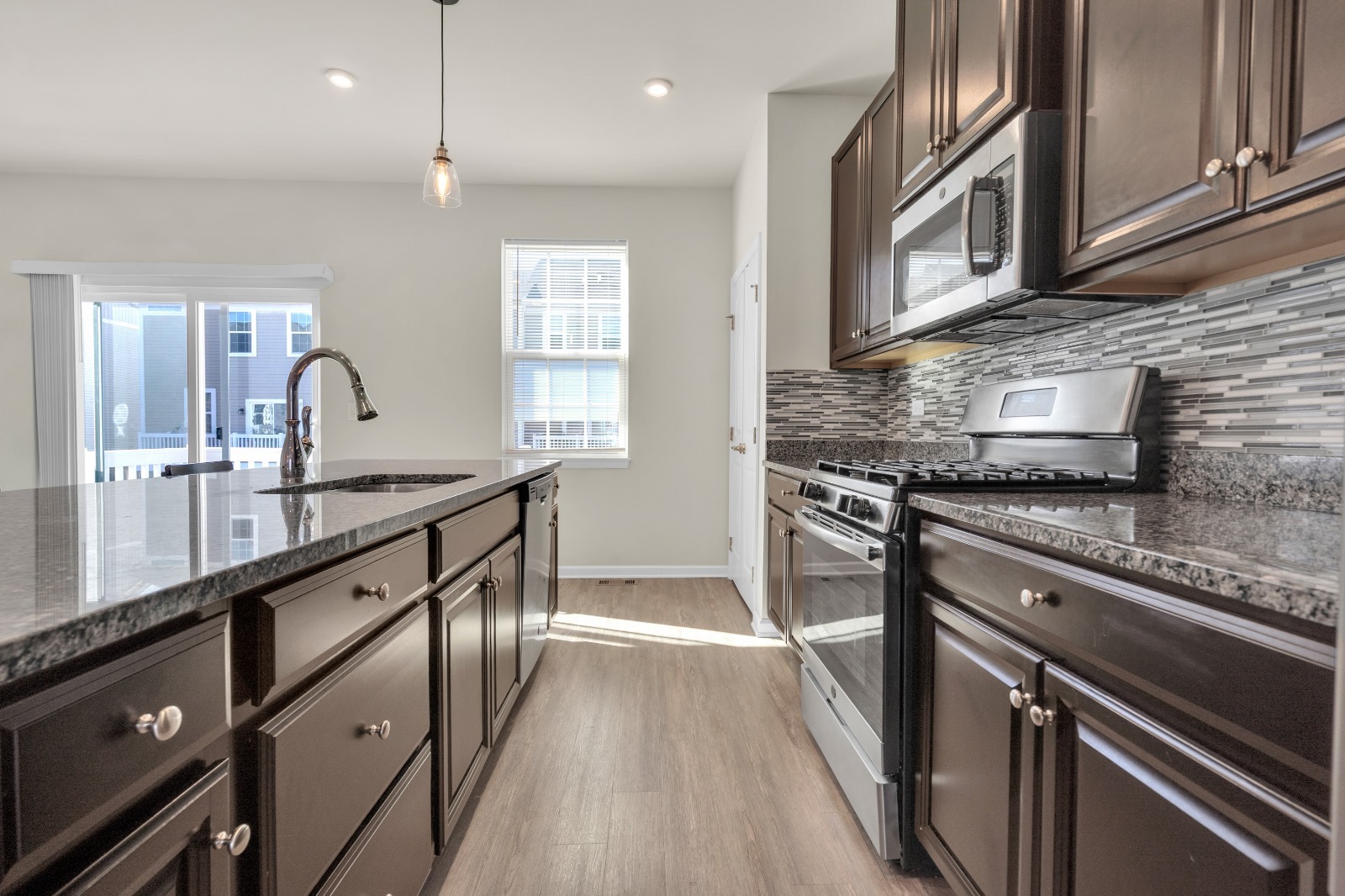 773 Rockwell Lane Des Plaines, IL 60016 - Photo 9 of 22 a kitchen with granite countertop a sink stainless steel appliances and cabinets